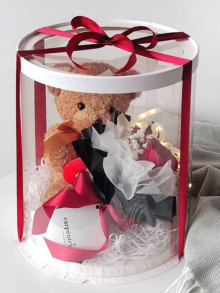 Teddy bear in sale box